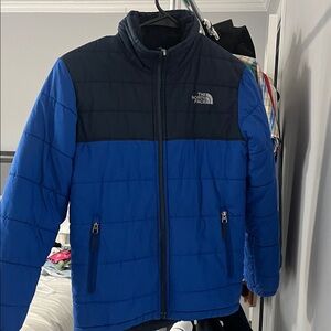 The North Face Blue and Black Puffer Boy Jacket sherpa liner. Size 10/12